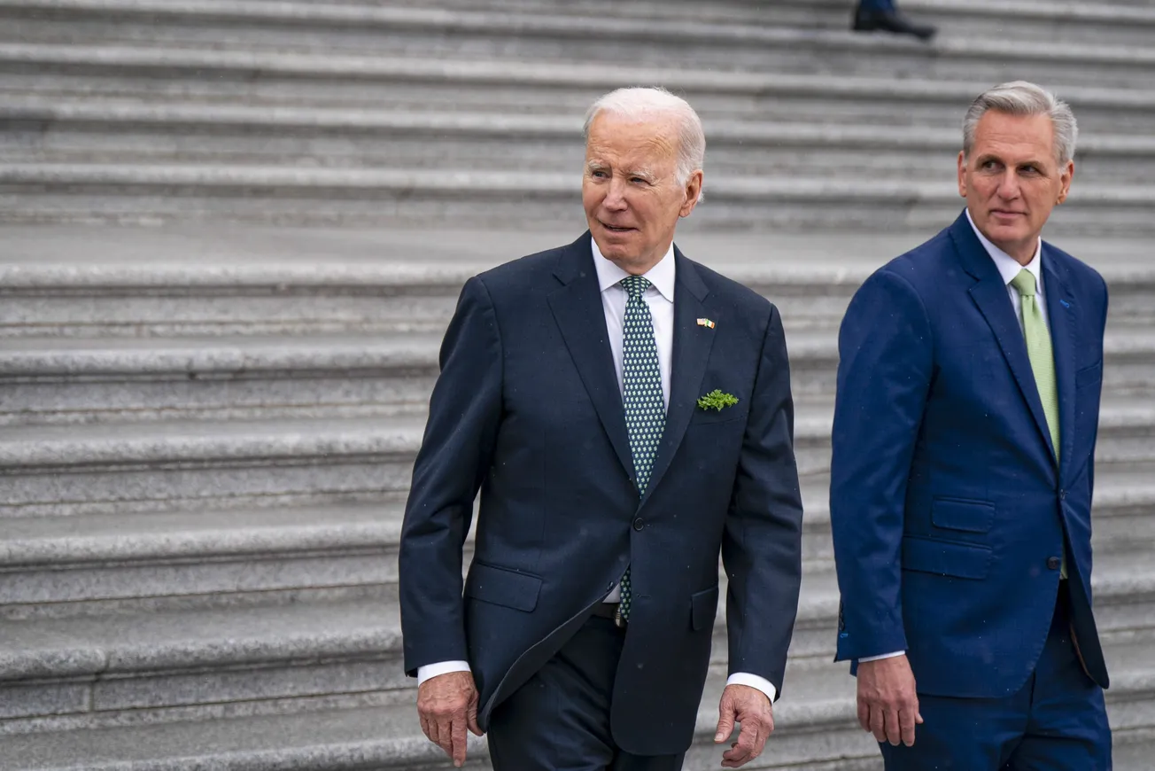 President Joe Biden walks with House Speaker Kevin McCarthy (R-Calif.) down the House steps at the Capitol in Washington, Mar